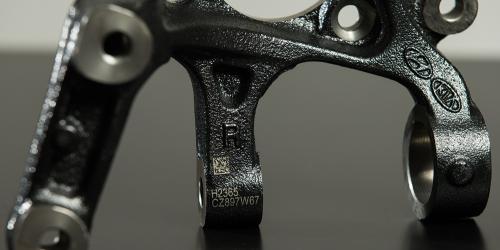 Steel engraving on automotive part