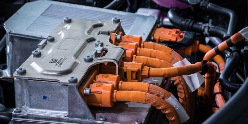 Electric vehicle motor with flat top and large orange cables ready for laser, dot-peen or scribing marking with gravotech machines