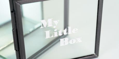 Engraving on a glass box filled with silver gilding wax